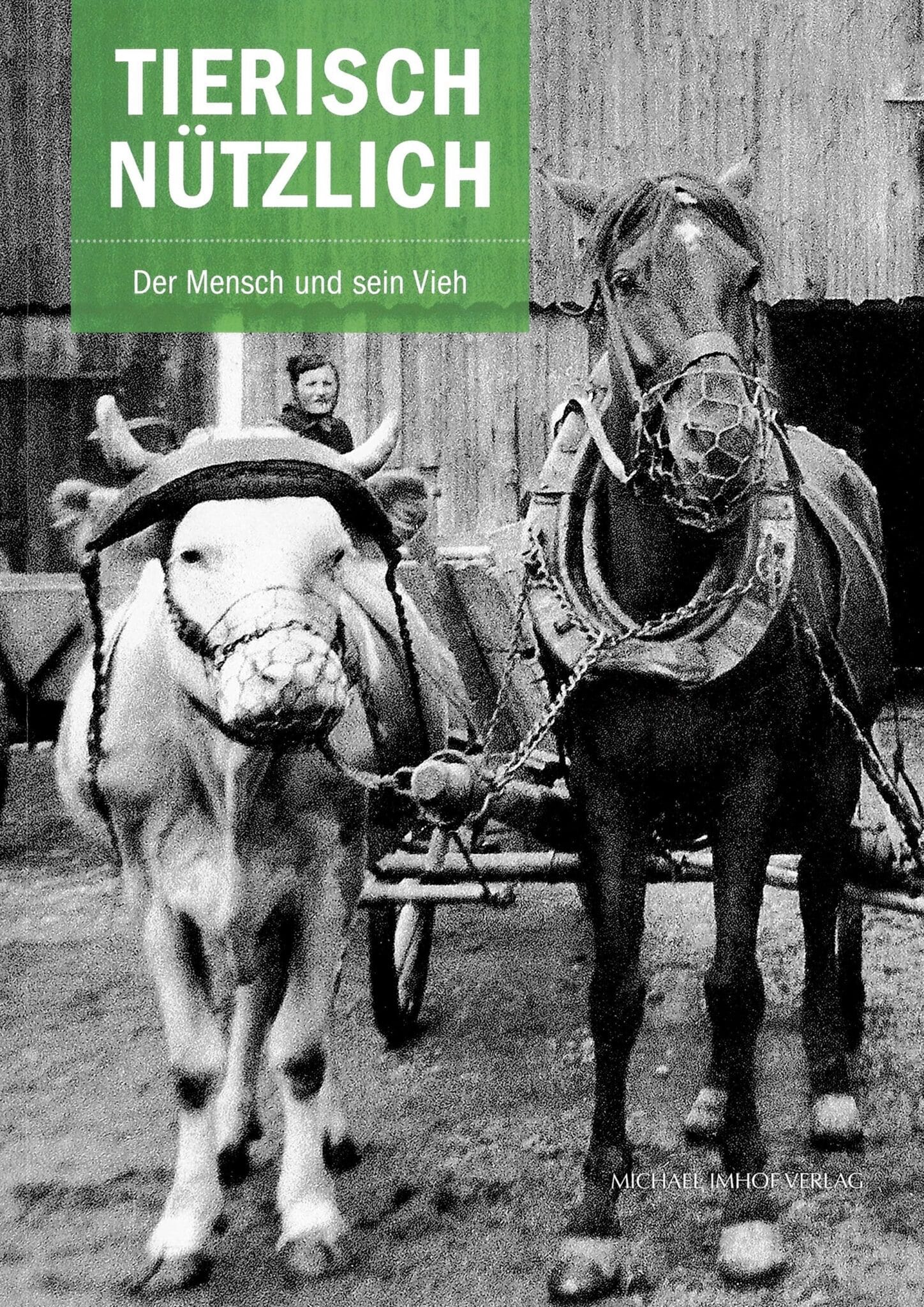 Auf einem Buchcover steht "Tierirsch Nützlich. Der Mensch und sein Vieh", darunter ein Schwarz-Weiß-Bild mit einem Ochsen-Pferde-Gespann